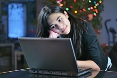Smiling Girl On A Laptop – TGIF’s Daily Jigsaw Puzzle