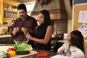 Family Time – Mother and Father Making a Salad